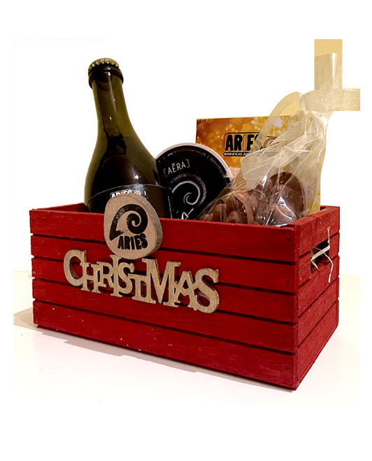 La cassetta rossa Christmas con la bottiglia Aera e il cioccolato
