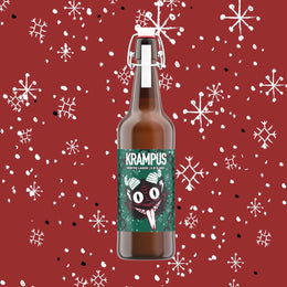 La bottiglia con tappo meccanico sul fondo rosso a fiocchi di neve, l'etichetta verde con il Krampus