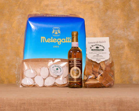 I 4 prodotti del cesto «Pensiero di Natale» disposti sul fondo di juta, fra cui Panettone Melegatti classico, Cantuccini artigianali alle mandorle e Vin Santo Toscano, e gli altri.