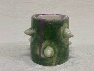Green tumbler with poured purple glaze