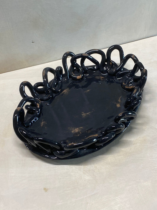 Centro tavola ovale nero, dettaglio dell'intreccio