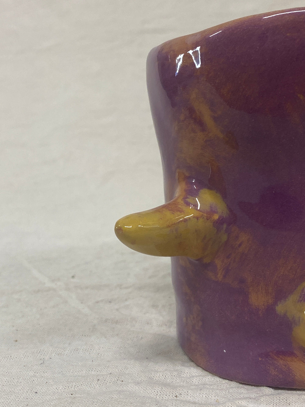 Purple and yellow tumbler with painted cacti