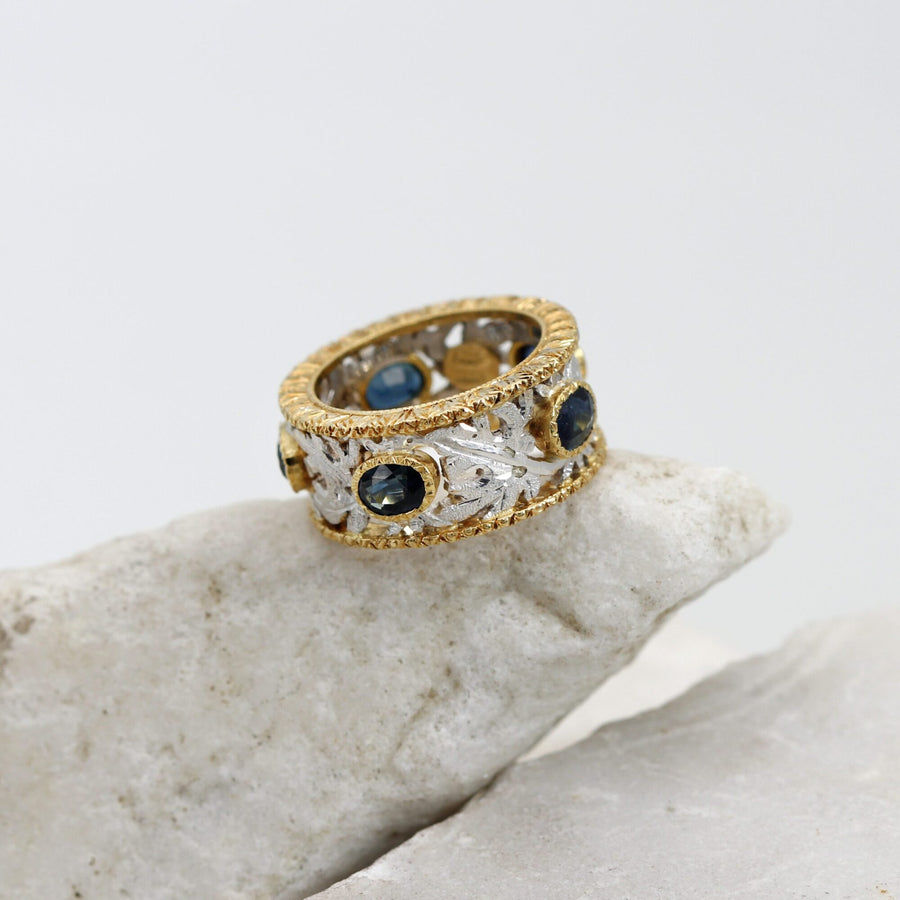 Wedding band with sapphires, the ovals set in yellow gold