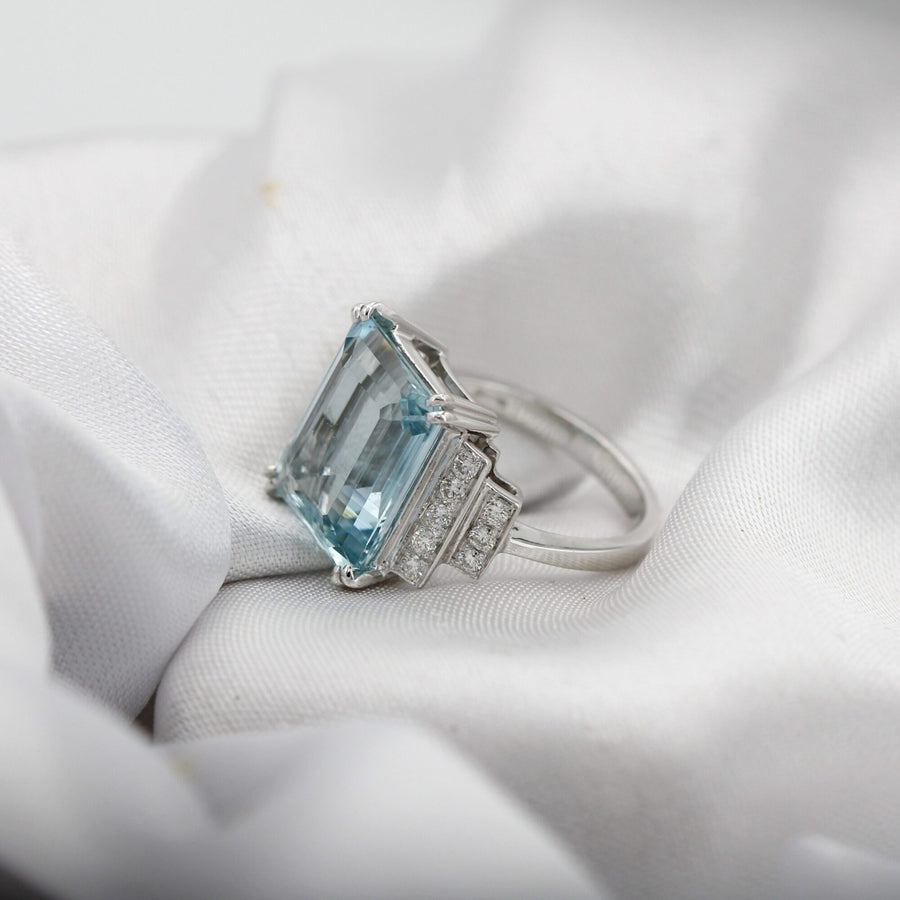 Three-quarter view on white silk, with the shank running behind the bezel