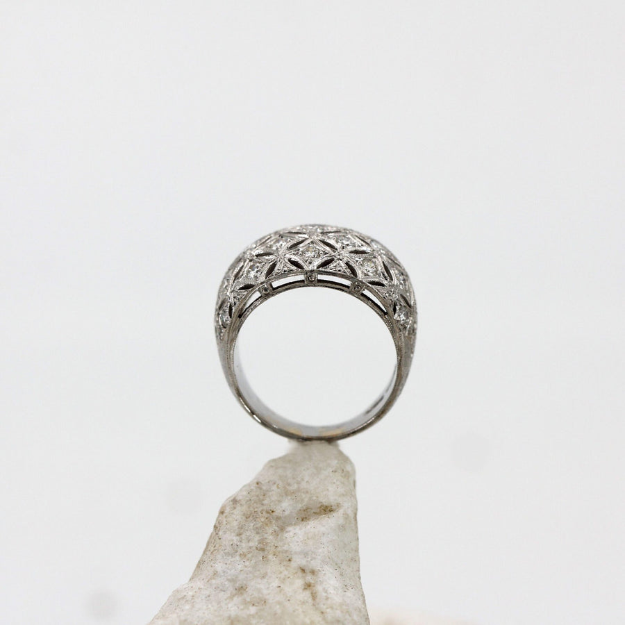 Domed white gold ring, close-up of the beaded rim