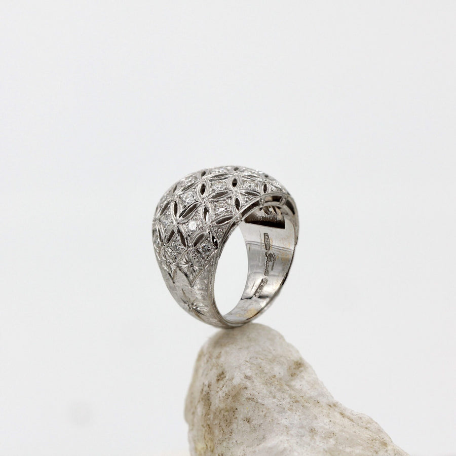 Domed white gold ring, the mesh against the light