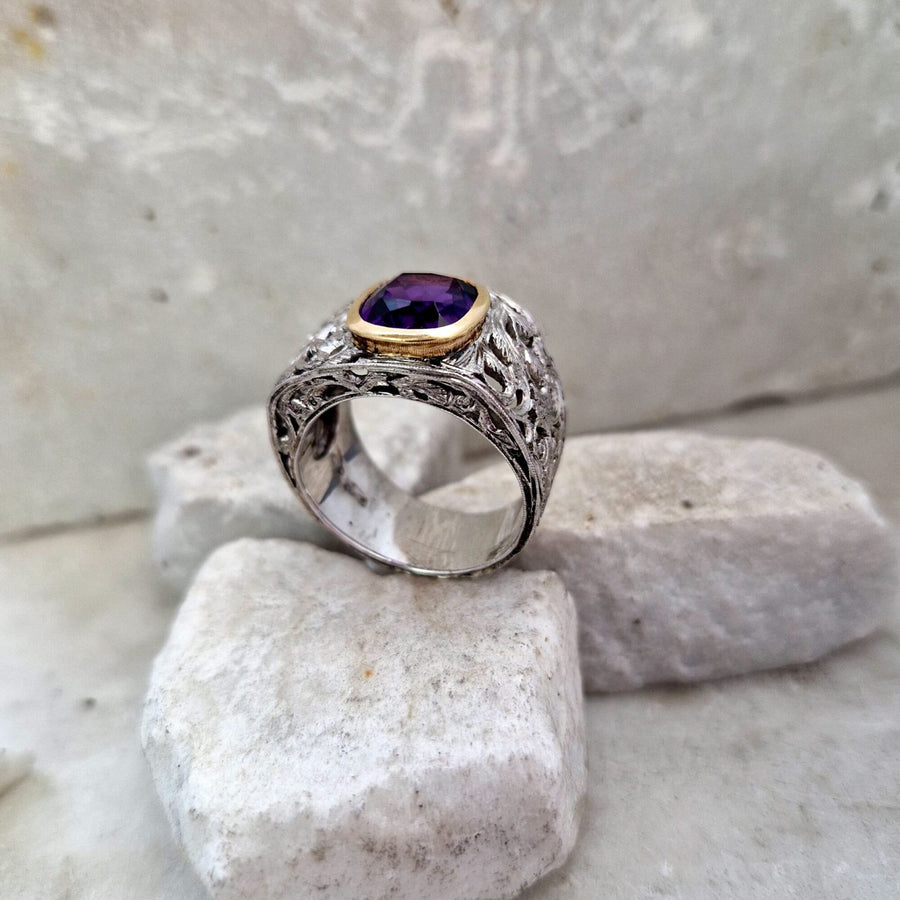 The ring standing, almost from the front: the height of the openwork dome and the stone off the axis of the finger