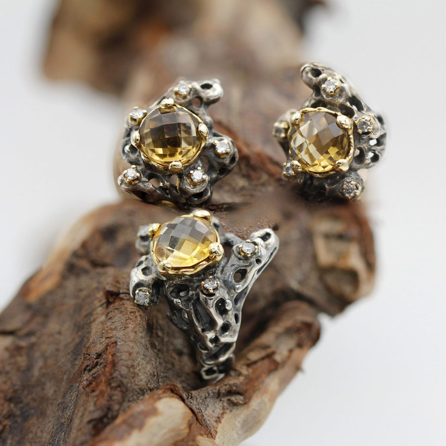 The ring next to the two Marte earrings from the same series, which are not included.