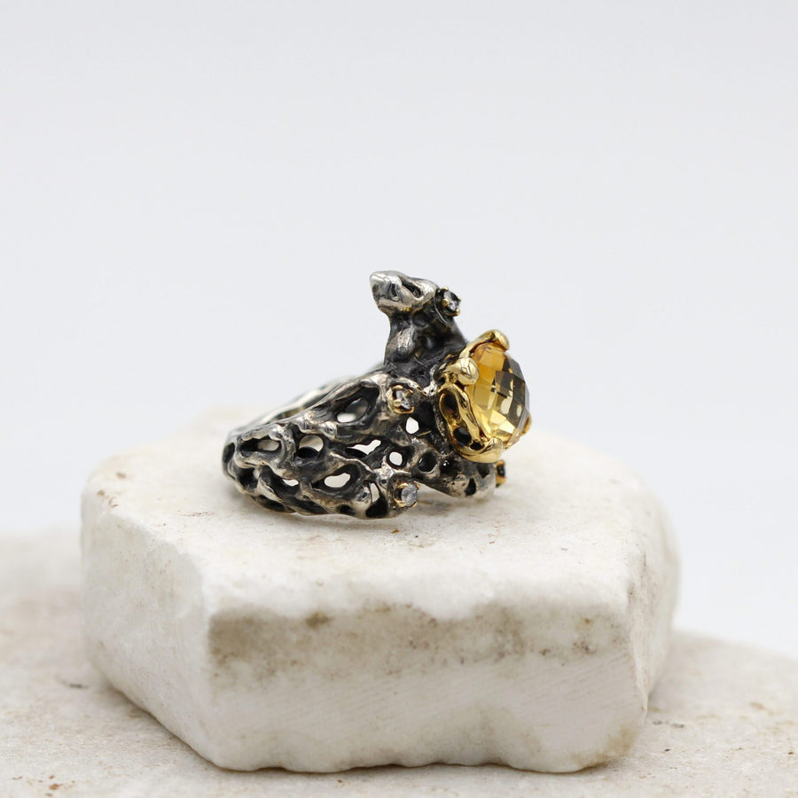 Side view: the thickness of the silver and the holes that cross it right through.