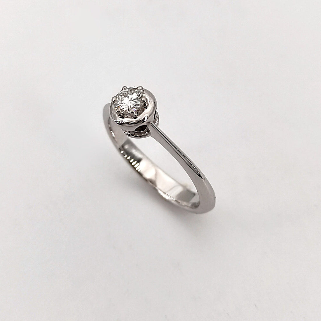 The brilliant in the round bezel, shot from above on a white background