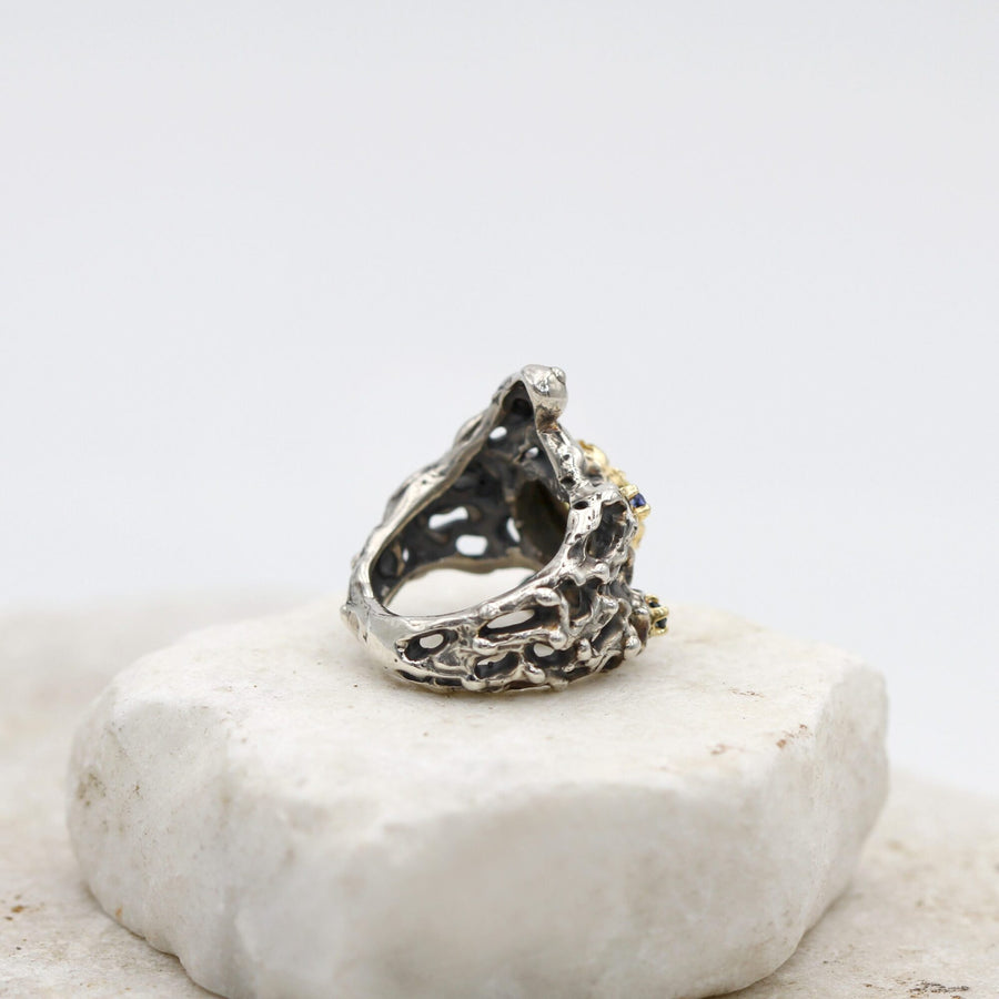 The ring standing: the inside of the band and the space beneath the silver dome are visible
