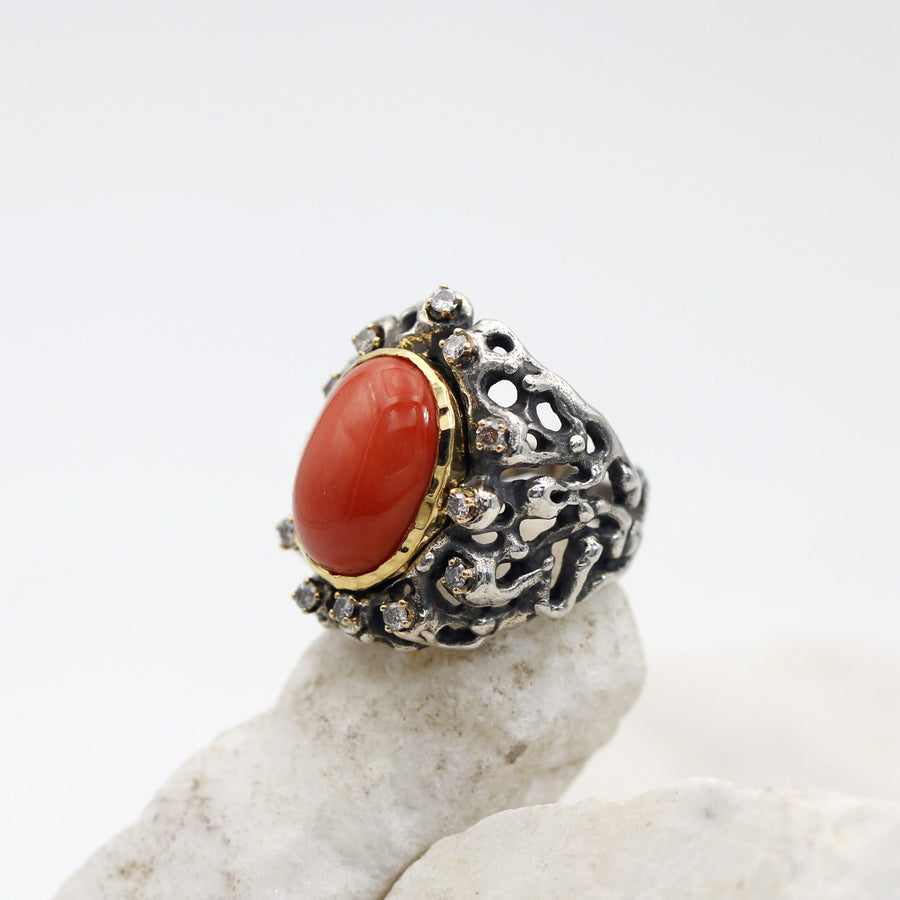Three-quarter view from the other side, with the grey diamonds on the shoulder of the ring