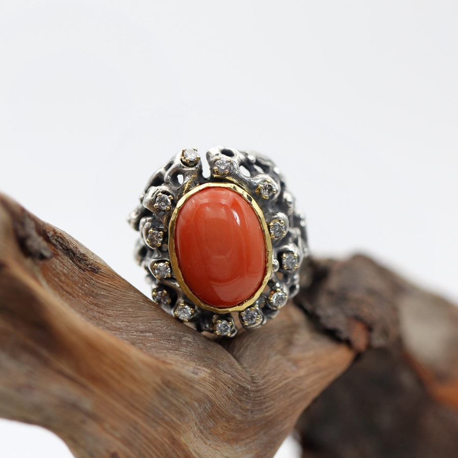 The whole piece in three-quarter view, coral and silver in the same frame