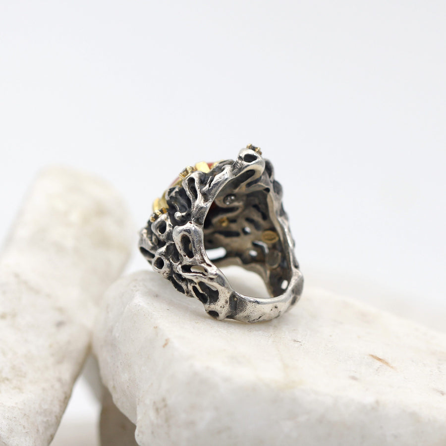 Profile: the holes in the silver pass right through and lower down the band turns smooth again