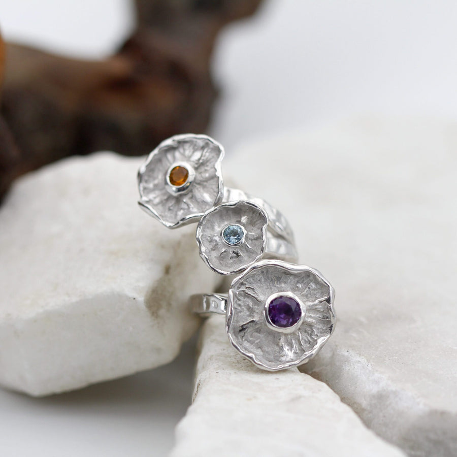 The ring turned the other way: the flowers have rotated and the order of the colours comes up reversed