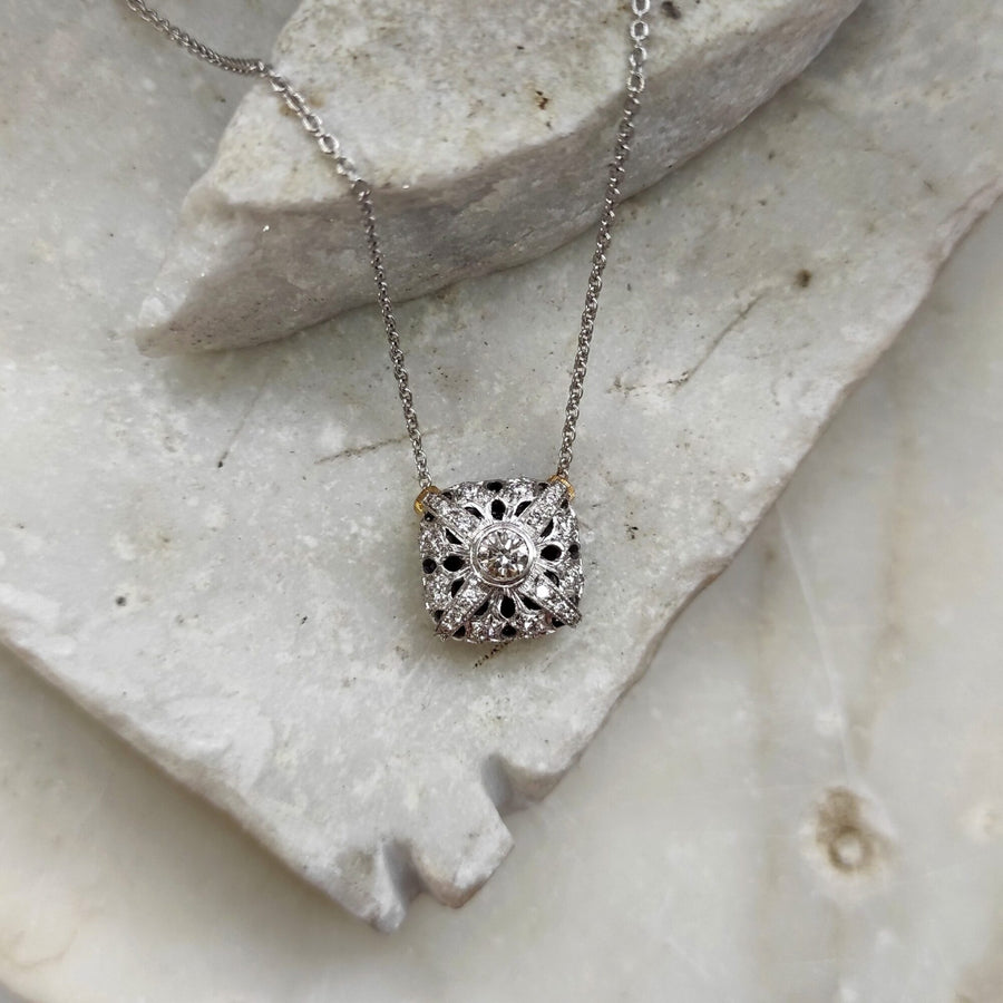 Hanging from a shard of marble, from the front