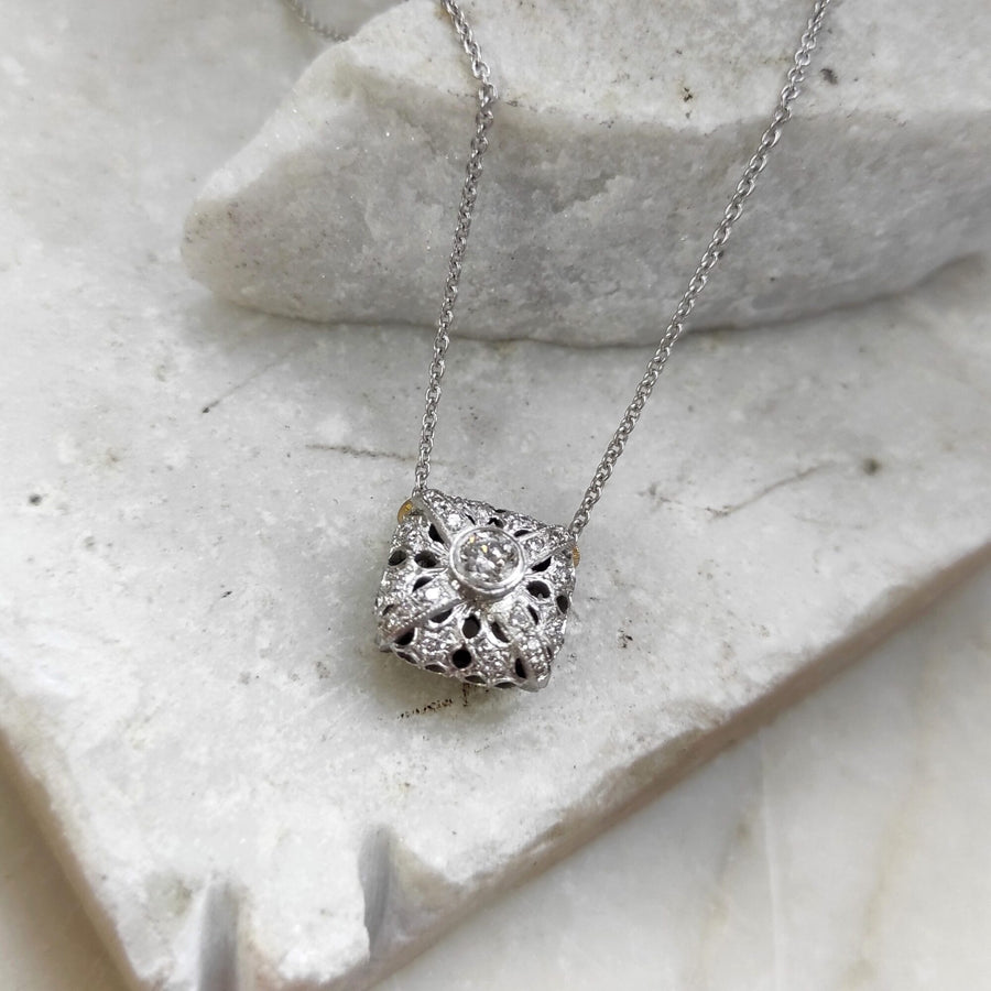 On the marble with the chain pulled taut, the link of the chain in close-up