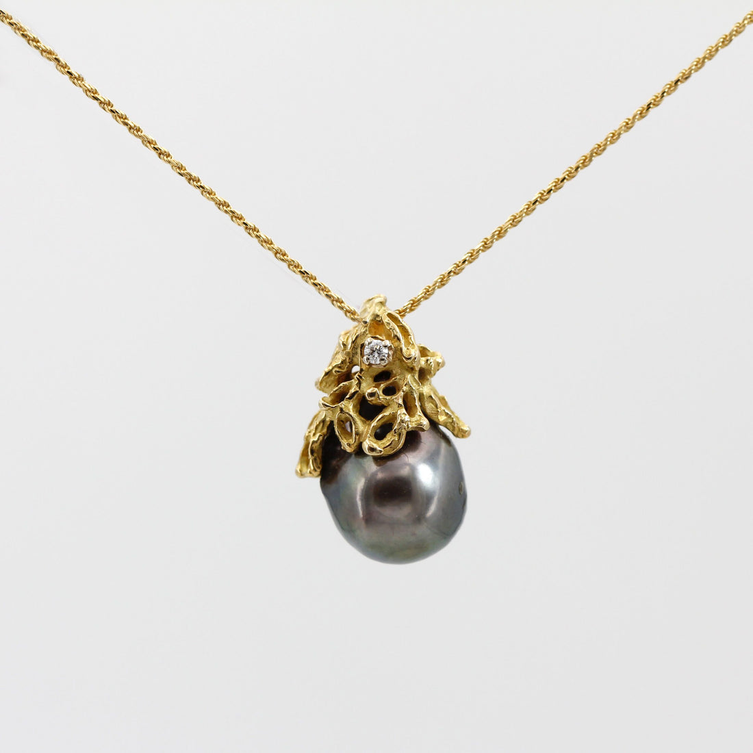 The pendant hanging from the chain on a white background, overall view (the chain is not included)