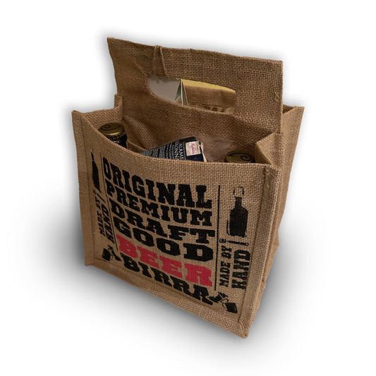 La shopper aperta, con le bottiglie e i salumi dentro