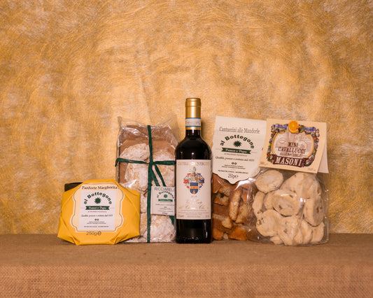 I 5 prodotti del cesto «Festa Toscana» disposti sul fondo di juta, fra cui Vin Santo del Chianti Castello del Querceto, Ricciarelli artigianali e Cantuccini alle mandorle artigianali, e gli altri.
