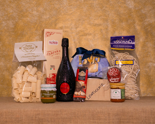 I 11 prodotti del cesto «Gioia di Condivisione» disposti sul fondo di juta, fra cui Panettone tradizionale Biffi, Pinot Nero Spumantizzato Brut Bellussì e Zampone Palmieri, e gli altri.
