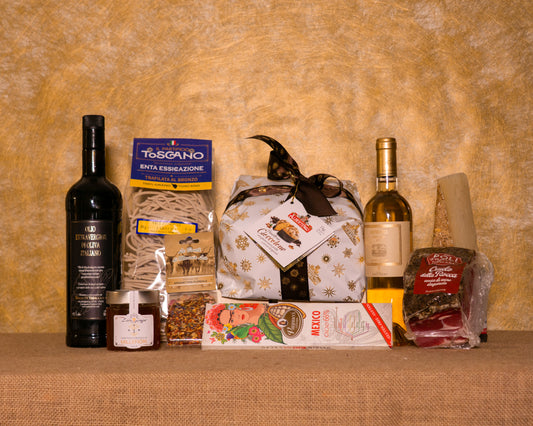 I 9 prodotti del cesto «Il Lusso del Palato» disposti sul fondo di juta, fra cui Panettone Albertengo al cioccolato, Muffato della Sala e Crudo saporito toscano Poli, e gli altri.
