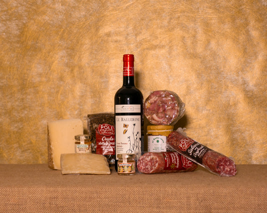 I 10 prodotti del cesto «Tagliere Toscano» disposti sul fondo di juta, fra cui Crudo Toscano Poli, Salame di cinghiale Poli e Salame al finocchio Poli, e gli altri.