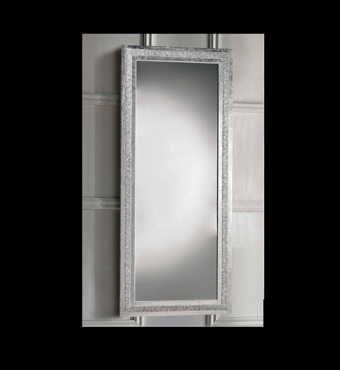 The 1594 mirror hanging vertically: the grained silver band and the bevelled edge of the glass