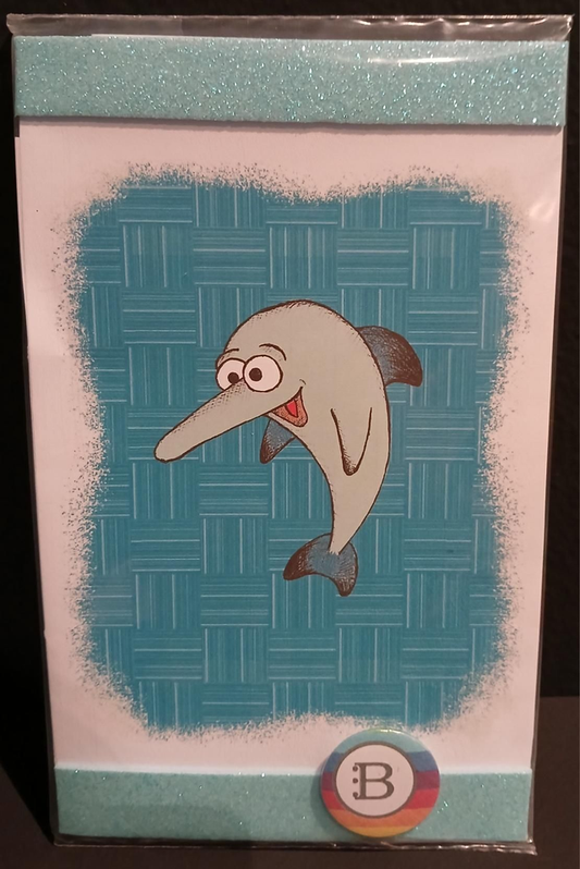 Il quadretto con il Delfino e la spilletta Bookendipity, nella confezione