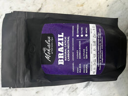 Il sacchetto nero del Brazil Natural Catucai Carbon Neutral, con l'etichetta viola