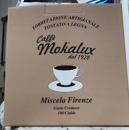 La scatola di cartone delle cialde, con il marchio Caffe Mokalux dal 1920 e la dicitura Miscela Firenze
