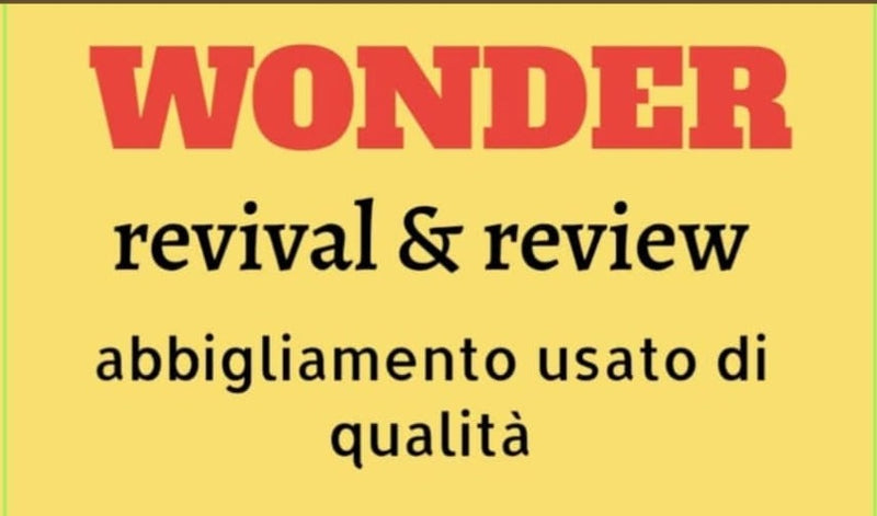 L'insegna gialla del banco Wonder: revival & review, abbigliamento usato di qualità